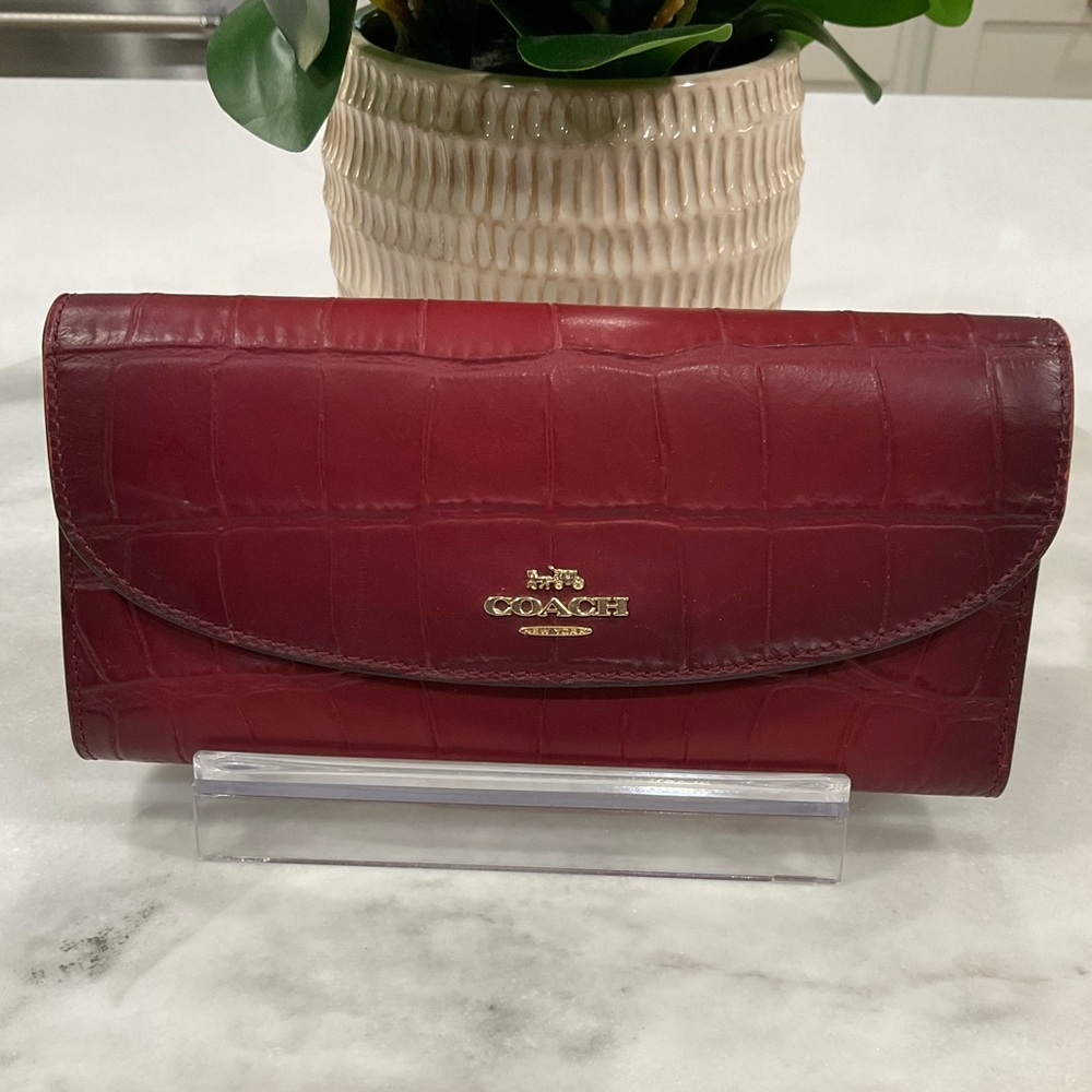 Coach Cherry Burnished Crocodile embossed leather wallet.
